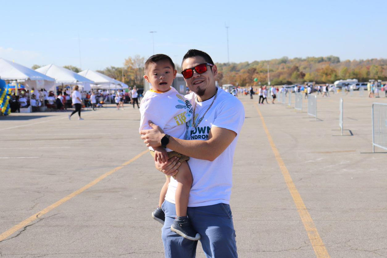 Man Holding Child At Walk